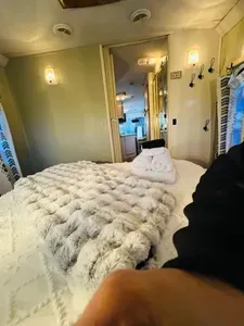 View of bedroom from nightstand corner.