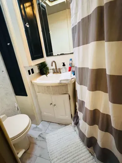 Bathroom features a new tile floor — fresh, clean, and spa-inspired for your comfort.