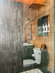 Master bath with a luxurious walk in shower, backlit mirror, bluetooth speaker and 36" vanity.  