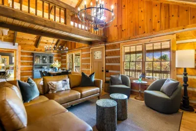 Open floor plan with the kitchen, dining room and living room together.  Sit in any spot and look a the wonderful mountain views.   There is a wood burning fireplace and a smart tv to cozy up and watch movies!
