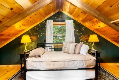 Loft area where there is a trundle which has two twin beds. This loft overlooks the living and dining room. It is accessed by a spiral staircase