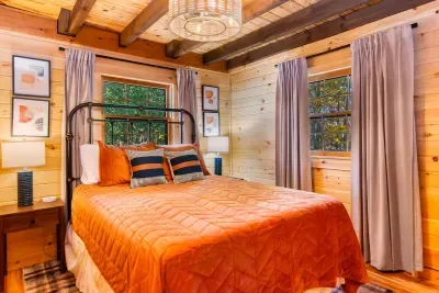 This bedroom is off of the living room with a queen bed.  Has bedside ports for your technology and a smart tv to relax and watch your favorite movie!