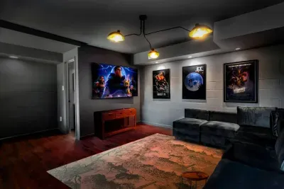 Take a break in the basement media room where you can relax and read a book, play a game of darts, or watch a movie.  This room is a separate entrance from the main house. 