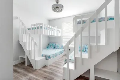 The bunk room features 2 full over queen sized beds with safety railings and stairs!