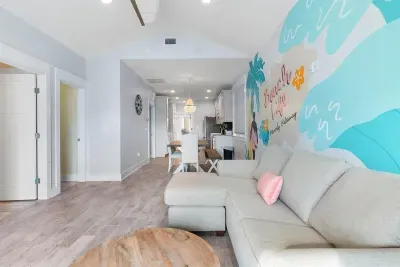 The living room is bright and relaxed, with plenty of seating and space to stretch out, talk, and enjoy time together after a long day.