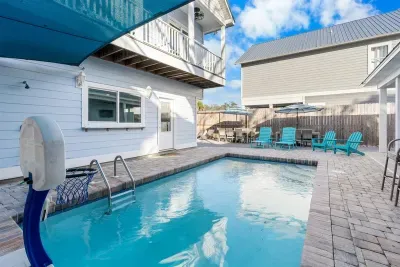 The pool sits comfortably between the home and outdoor seating, making it easy to move from swimming to relaxing without missing a beat.