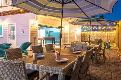 Outdoor dinners stretch late into the evening with string lights, comfortable seating, and that relaxed Florida air.