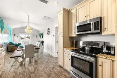 Cooking here never feels like a chore. The open kitchen and dining space keeps everyone connected, whether someone is cooking, setting the table, or just hanging out nearby.