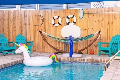 The pool area is playful and relaxing at the same time, with floats, seating, and space to enjoy sunny afternoons or laid back evenings.