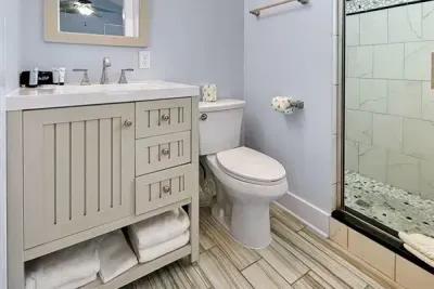 A clean and comfortable bathroom with a walk in shower and fresh finishes that make getting ready feel easy and unhurried.