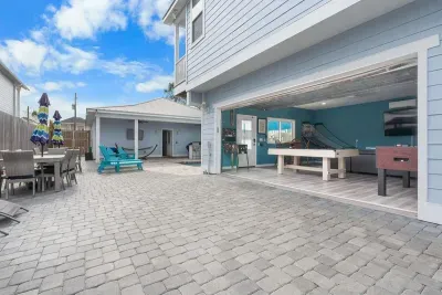 The Game room opens up to the pool deck so you can enjoy fun for days!