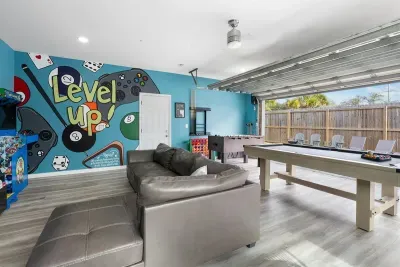 This game room is always full of energy, with a pool table, lounge seating, and space for everyone to jump in and have fun.