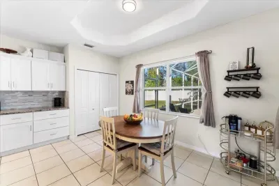 Breakfast nook inside the kitchen with seating and natural light, ideal for morning coffee or casual dining.