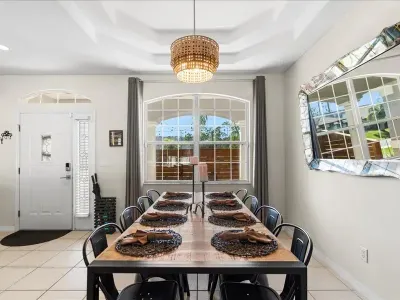 Spacious dining room with plenty of natural light, perfect for family dinners and shared vacation moments.