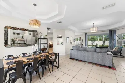 Another angle of the open living area showcasing the spacious floor plan and comfortable furnishings.