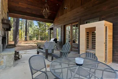 Spacious patio with ample seating, perfect for outdoor dining or evening conversations and a Sauna