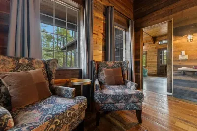 Spacious interior with open wood beams and inviting rustic details throughout.