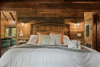 Primary bedroom retreat featuring soft lighting, luxurious linens, and handcrafted details.