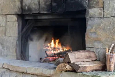 Inviting stone fireplace that sets the mood for relaxing evenings by the fire.