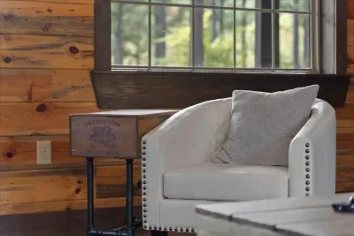 Cozy reading corner with a soft armchair and warm lighting, perfect for quiet moments.