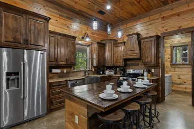 Beautiful kitchen with stainless steel appliances, granite countertops, and plenty of space to cook and gather.