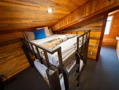This tucked away bunk nook feels cozy and private, giving guests a quiet space to rest and recharge