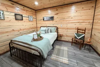 Simple and peaceful, this bedroom offers a comfortable place to rest and recharge during your nature escape