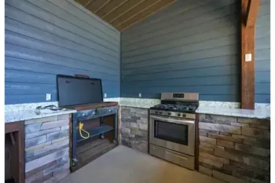 An outdoor kitchen setup that makes cooking part of the experience, with everything you need for relaxed meals outside