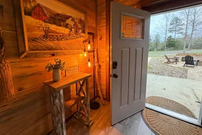 The entry welcomes you with warm lighting and rustic charm, setting the tone for a comfortable countryside escape