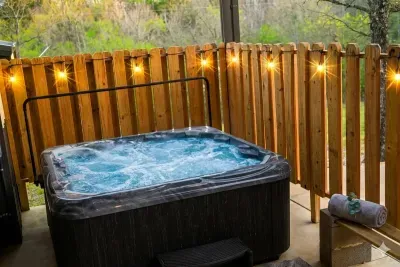 Soak in the hot tub under soft lights and fresh air, one of those simple moments that make this nature getaway unforgettable