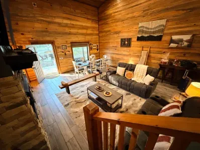 The living area feels open yet cozy, with warm lighting and comfortable seating that invites everyone to settle in