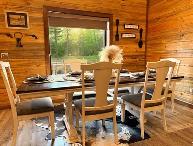 Dining by the window brings in soft natural light and peaceful views, making meals feel even more special