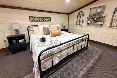 A cozy bedroom with warm wood tones and a comfortable bed that makes it easy to unwind after a full day outdoors