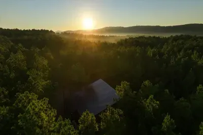 Beautiful sunset view over the rolling hills and treetops