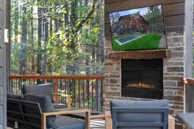 View of the deck looking toward the outdoor entertainment area and yard