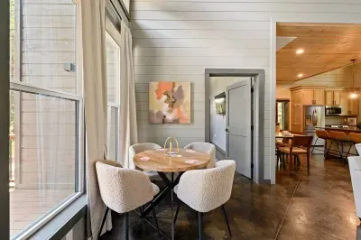 Breakfast Nook: Enjoy sunny mornings and game nights at this stylish round table with vibrant views!