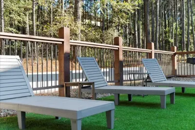 Outdoor Pool lounge area with relaxing sunbeds to Sun and Relax