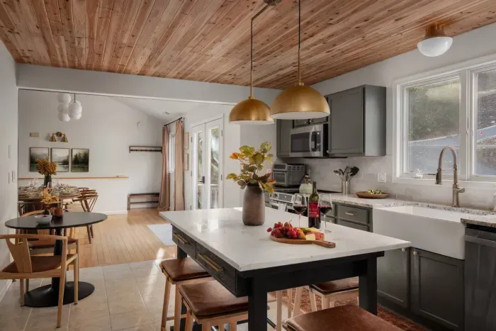 Gather, cook, and connect in the heart of the home. The kitchen and dining area offer seating for everyone — 10–12 at the table, 6 at the island, and 2 at the bistro — comfortably accommodating 18–20 guests for shared meals and celebrations.