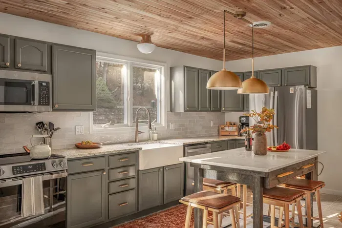 Recently remodeled and fully stocked, this bright kitchen has new stainless steel appliances, plenty of counter space. The island is great for casual meals, snacks, or hanging out while cooking.