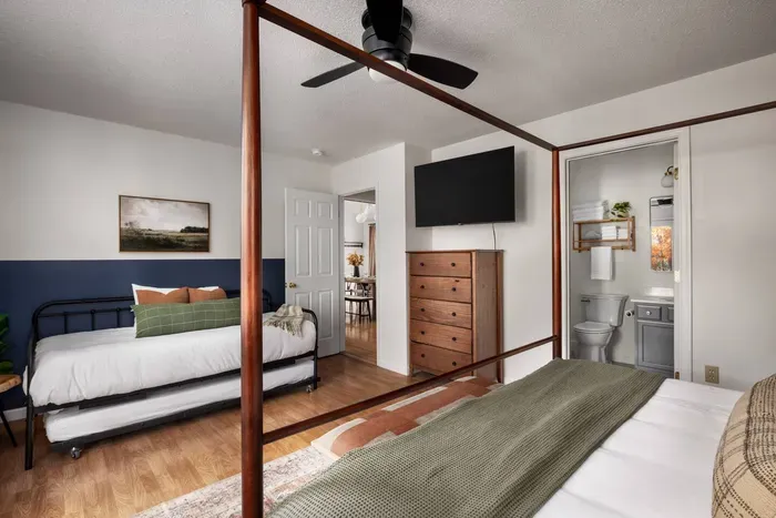 The master bedroom offers plenty of space for everyone, featuring a comfortable king bed and a convenient daybed with trundle—great for kids or additional guests.