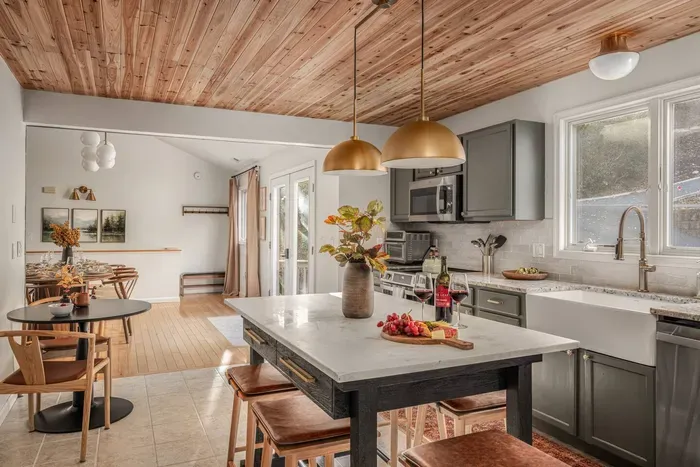 Gather, cook, and connect in the heart of the home. The kitchen and dining area offer seating for everyone — 10–12 at the table, 6 at the island, and 2 at the bistro — comfortably accommodating 18–20 guests for shared meals and celebrations.
