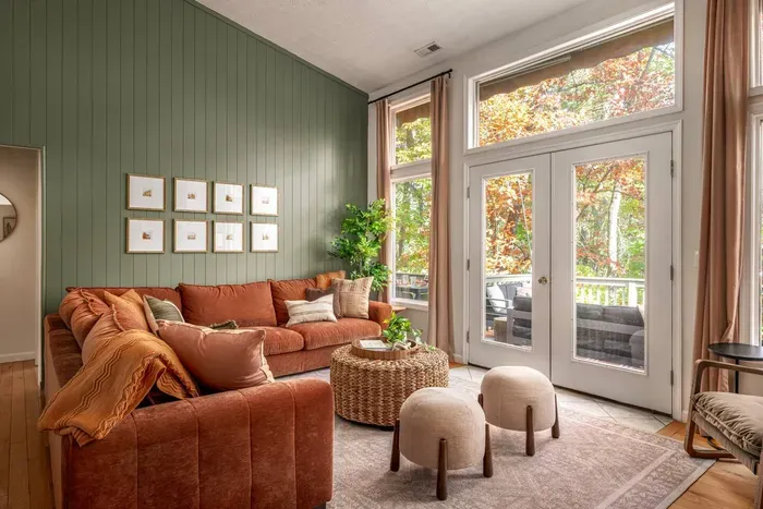 Gather with family and friends in this warm, inviting living room — where soft sunlight, earthy tones, and cozy seating create the perfect space for conversation, relaxation, and making memories together.