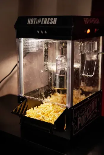 Complete the experience with freshly popped popcorn — a perfect finishing touch for your private theater night.