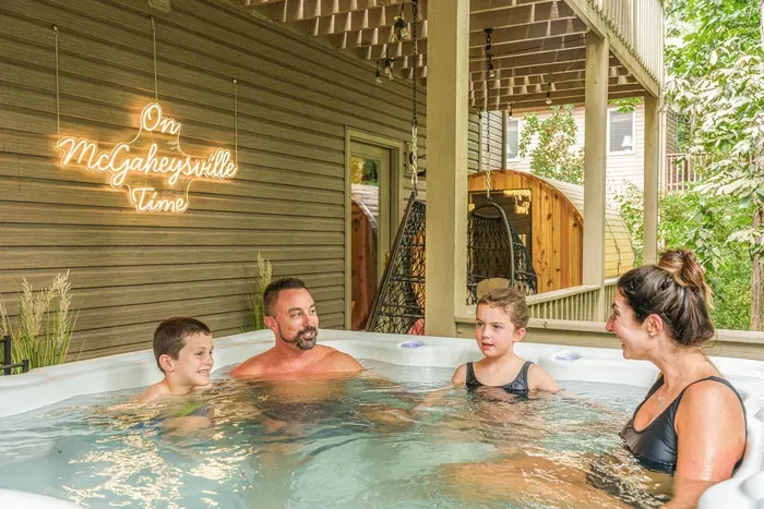 Where family memories are made  Enjoy evenings together in the private hot tub, rain or shine.