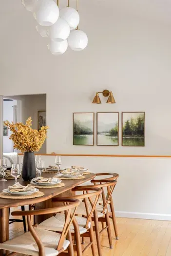A calm, minimalist dining nook with warm wood tones and an easygoing vibe.