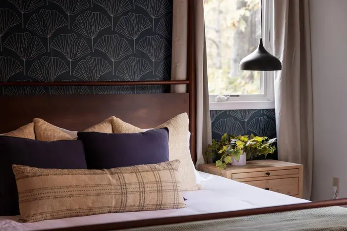 The master bedroom also includes a dresser and 50” Roku TV.