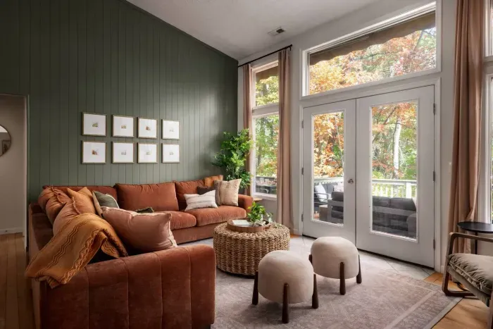 Gather with family and friends in this warm, inviting living room — where soft sunlight, earthy tones, and cozy seating create the perfect space for conversation, relaxation, and making memories together.