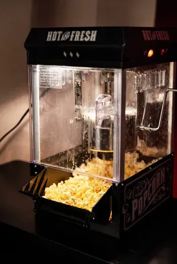 Complete the experience with freshly popped popcorn — a perfect finishing touch for your private theater night.