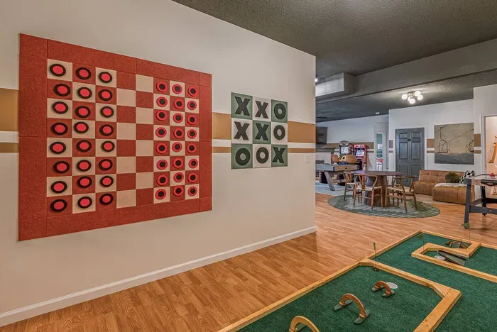 Enjoy life-sized checkers, tic-tac-toe, and indoor mini golf — playful touches that make the space fun for all ages.