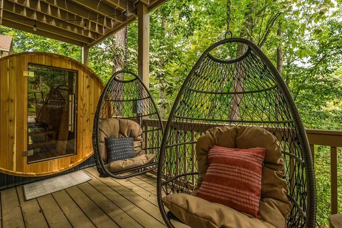 Unwind in these cozy swinging chairs beneath a canopy of lush forest trees.